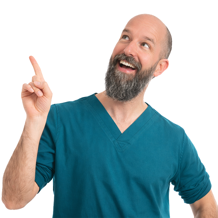 Tom without tattoos pointing and looking silly